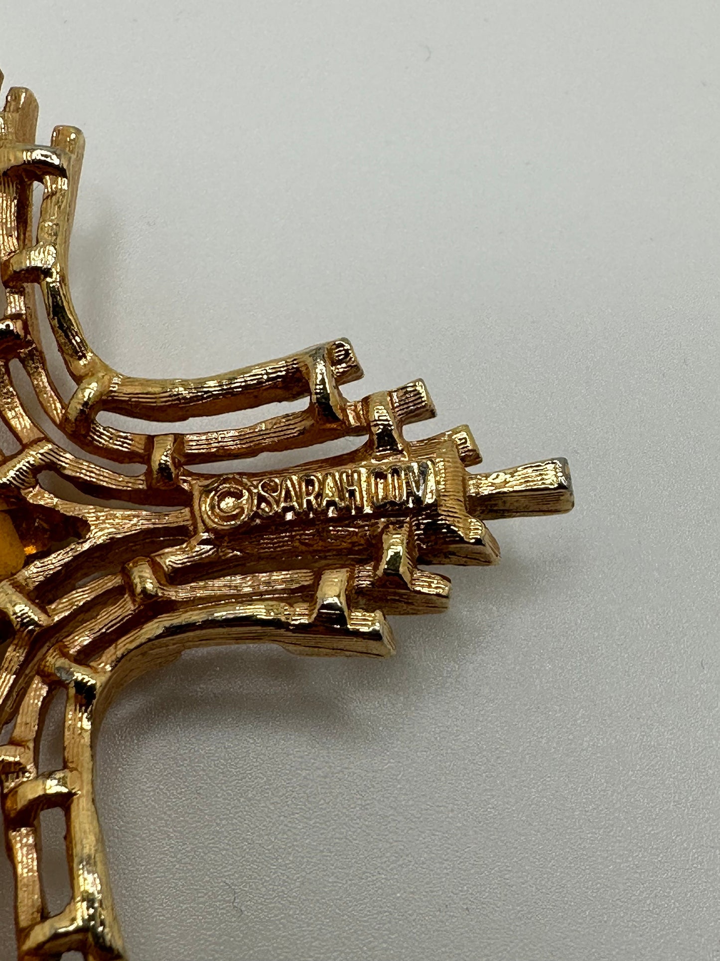 1960s 1970s Signed Sarah Coventry Gold Tone And Faux Topaz Omega Cross Pendant