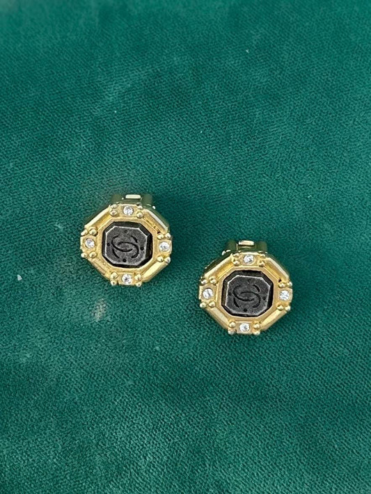 1980s Signed ROXANNE ASSOULIN Gold Tone Octagonal Rhinestone Faux CC Engraved Stone Clip-on Earrings