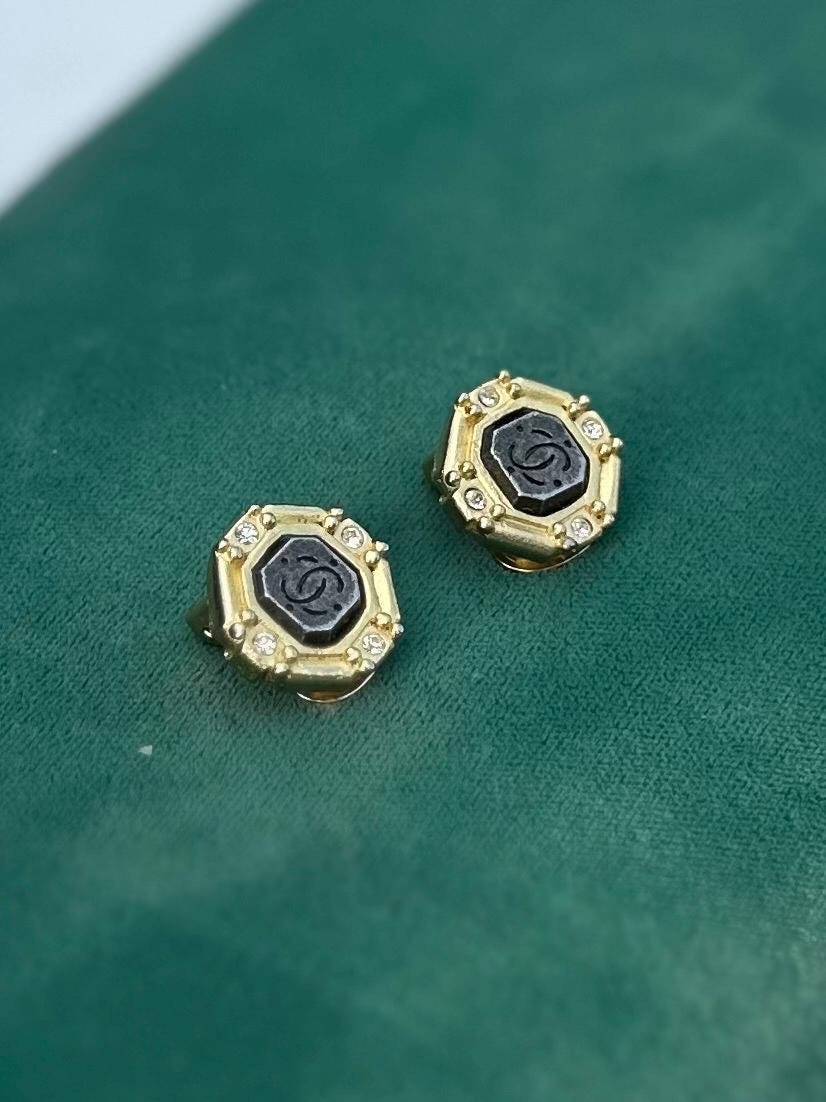 Vintage 1980s Signed ROXANNE ASSOULIN Gold Tone Octagonal Rhinestone Faux CC Engraved Stone Clip-on Earrings Rare