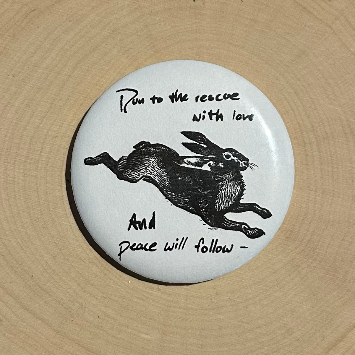 'Run to the Rescue with Love and Peace Will Follow' River Phoenix Button Pin